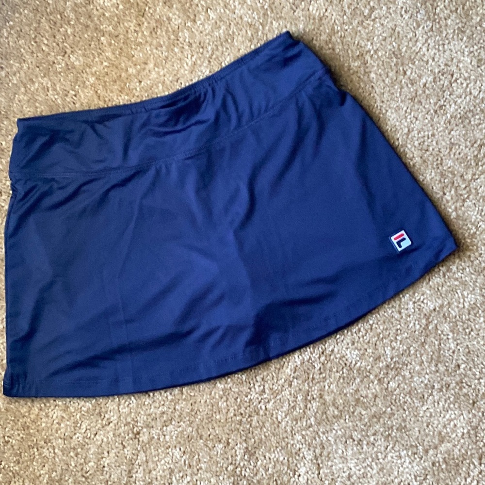 Fila Tennis Skirt with shorts underneath.  Women’s Size XS